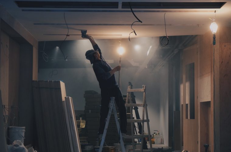 man on white ladder