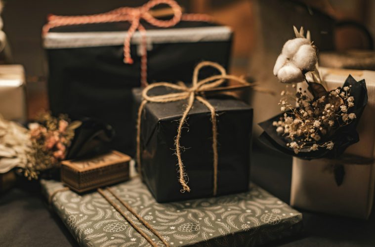 black and brown gift box on white and black floral textile